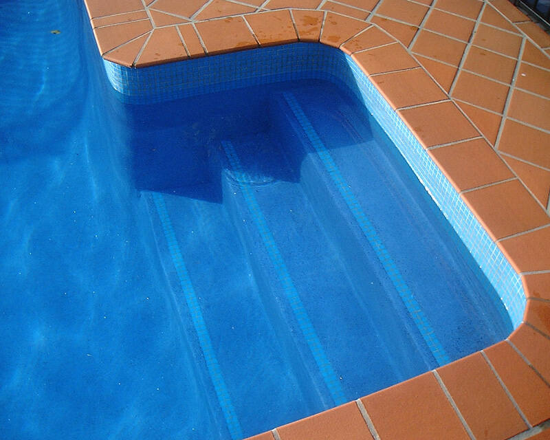 Blue tiled steps showcasing detailed pool tiling in Penrith.