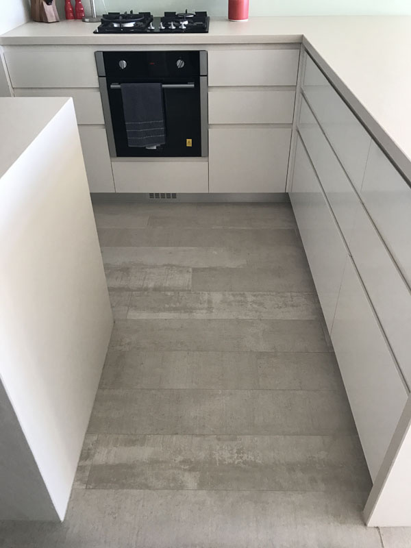 Contemporary kitchen floor tiles in a Glenmore Park residence, installed by tiling experts near Penrith