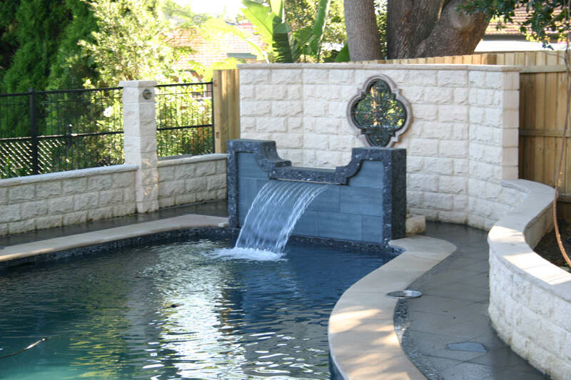 Elegant stone water feature by poolside with expert tiling in Penrith