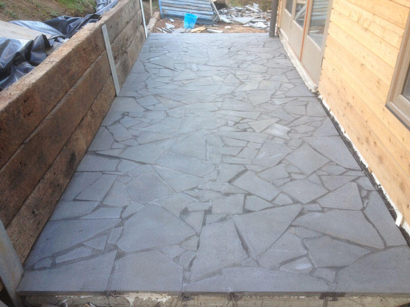 Unique and irregular stone patio flooring laid in Cambridge Park, by Penrith's experienced tilers